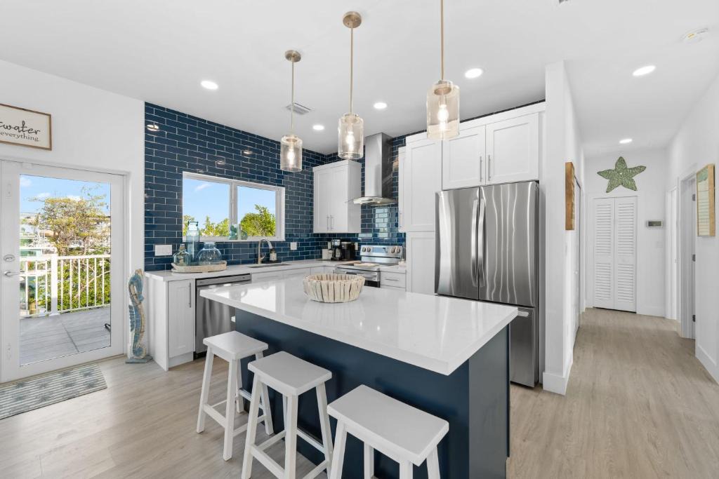 Marathon Villa | Blue Pearl New Waterfront Haven with Heated Pool ,70 Foot Dock, and More!