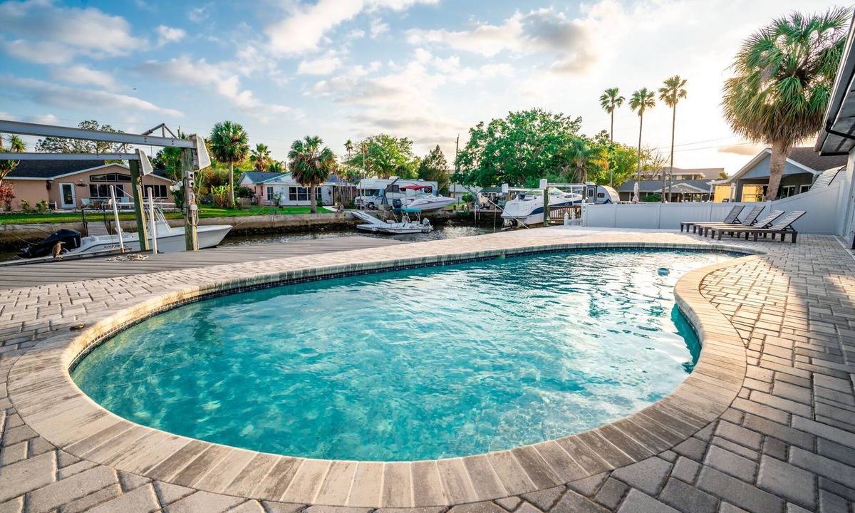 Port Richey House | Canal Front Getaway | Pool, Dock, Game Room + Screened Porch
