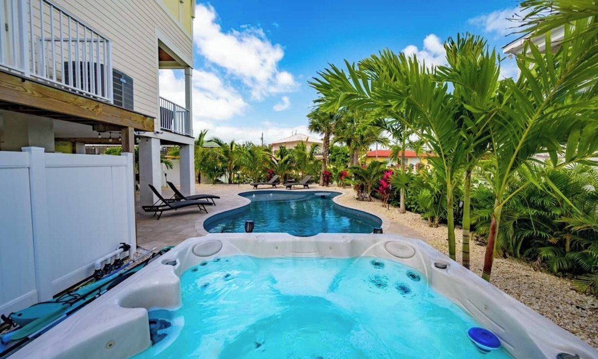 Marathon Villa | Canal Front with Large Custom Pool, Lush Landscaping, Hot Tub, 30' Dock, Kayaks!