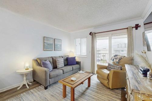 Fort Morgan House | Casual condo steps from the beach with AC balcony resort pools & free WiFi