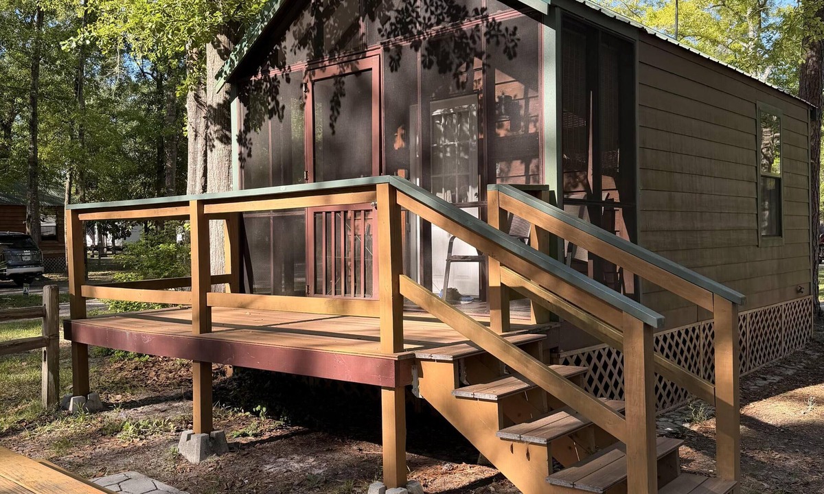 Folkston Cabin | Deluxe Cabin - The Bear Den - Our Deluxe Cabins offer comfort with a true Okefenokee feel. Climate controlled, private, and set in a quiet part of the campground.