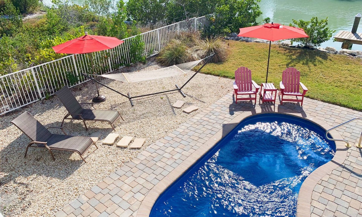 Marathon House | Escape To Marathon in Large 4BR 3BA Canal Front Home Sleep 10 with Heated Pool