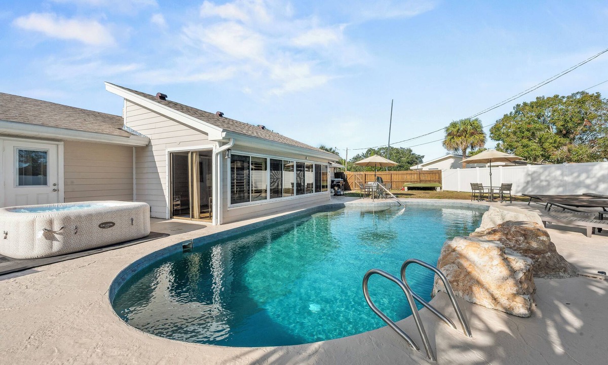 Merritt Island House | Furnished Retreat! Heated Pool, Spa, Game Room, and 4 King Beds!