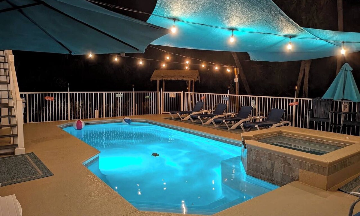 North Beach House | Island Oasis Walk to Beach Heated Pool + Hot Tub Private Putting Green