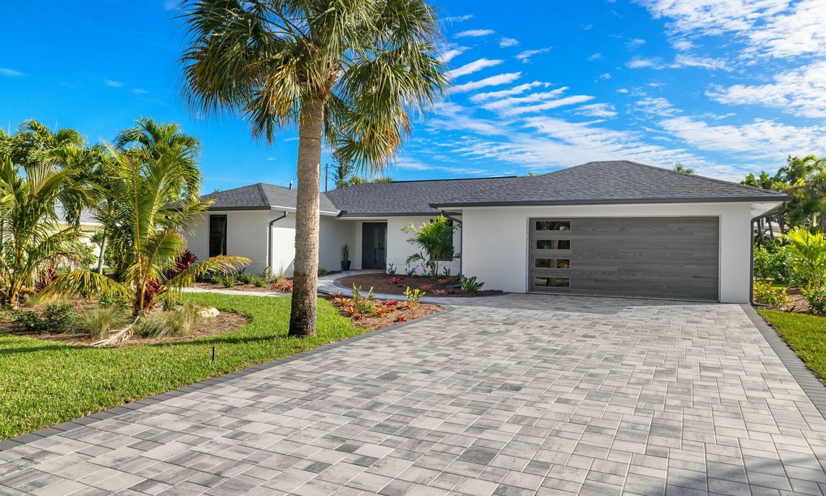 Shell Harbor House | Nestled along a pristine canal with long range views, this meticulously crafted residence defines coastal luxury at its finest.NEW!