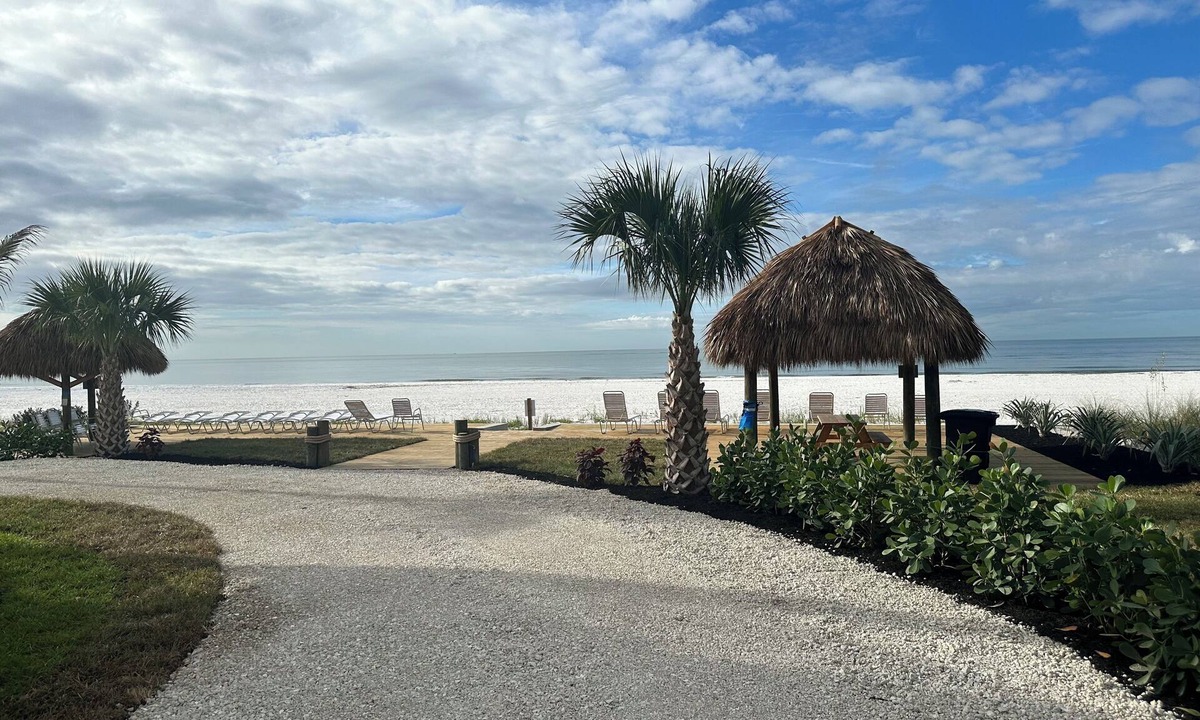 Mid Island Condo | ON THE BEACH AT THE SOFT WHITE SANDY SHORELINE