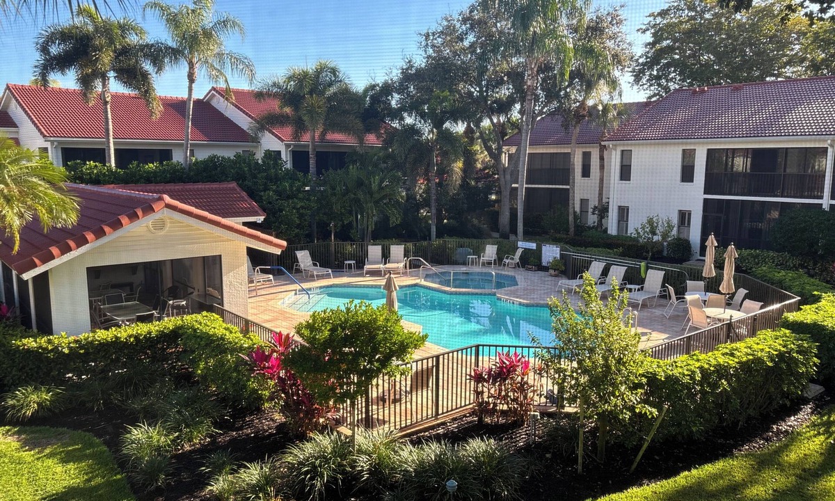 Pelican Bay Condo | Pelican Bay Condo overlooking pool and gardens, with private beach access.