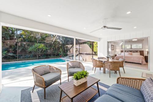 Moorings House | Pesaro - stylish 3BR retreat near Via Miramar Beach, beautifully renovated home with a private pool, lush tropical gardens and premium modern comforts, perfect for families and relaxing getaways, just minutes from sandy beaches and vibrant downtown Naples