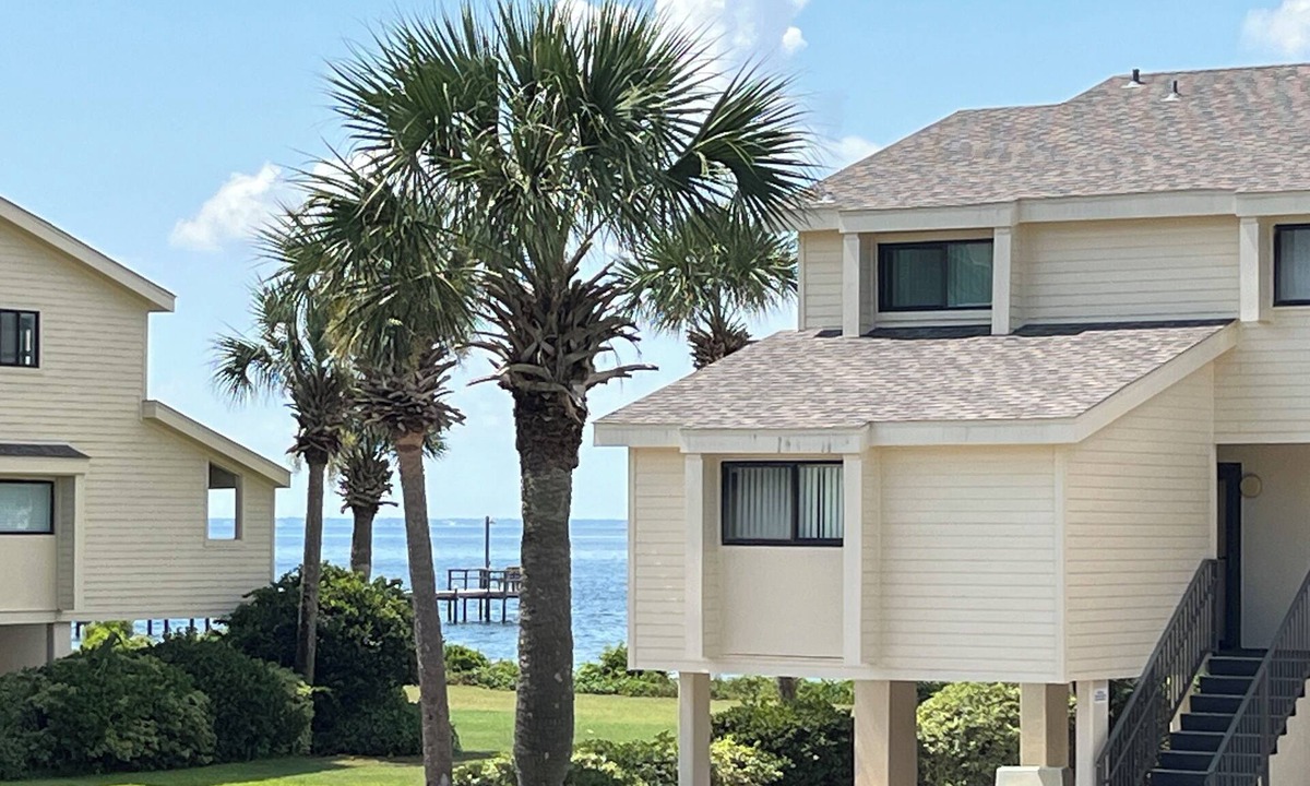 Pensacola Beach House | ROOMY 3 bedroom Waterview Sleeps 9-Pool Balcony Dock Pickleball on Trolley Stop