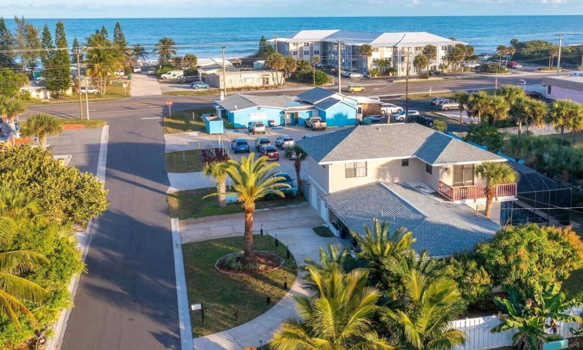 Satellite Beach House | SAND CASTLE: Big beach house. Walk to Beach. Heated Pool in screened pool house.