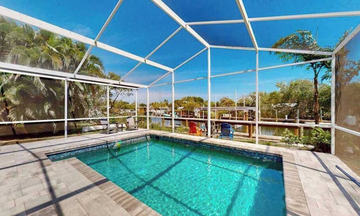Cortez House | Sunny canal front home with a pool & dock - central location and dogs ok