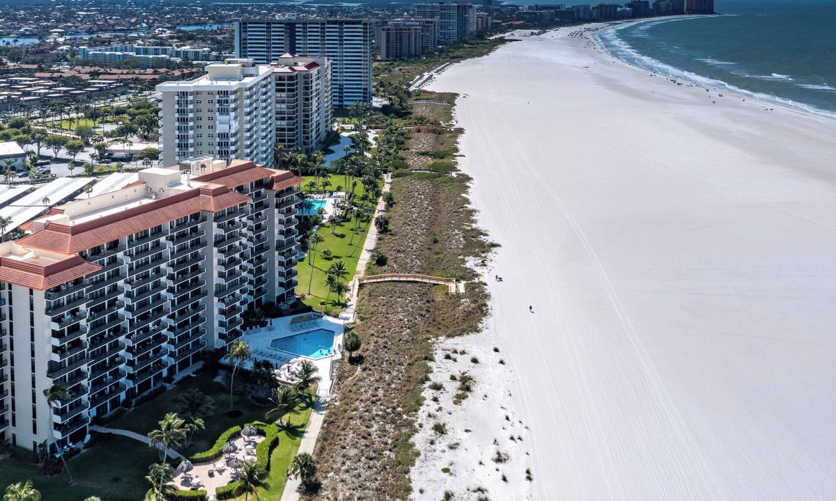 Marco Island Condo | Tradewinds 406- Amazing Coastal Cottage Beachside Condominium at the Tradewinds on Marco Island!