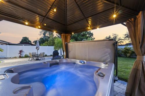 Crystal Lake House | Tropical Fenced Paradise, Hot Tub, & Home Theater