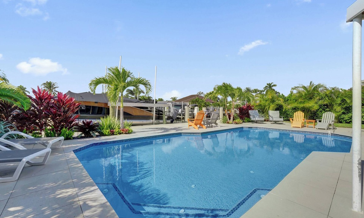 Garden Isles House | Tropical vacation retreat! Waterfront and Heated pool!
