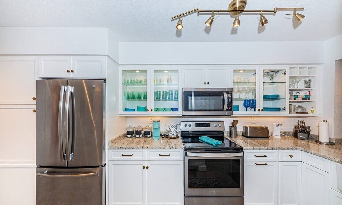 Isla del Sol Condo | Waterfront 2BR condo with pool, hot tub, balcony, and water views.