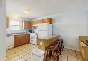 Beachside home steps from the water with pool access & central AC