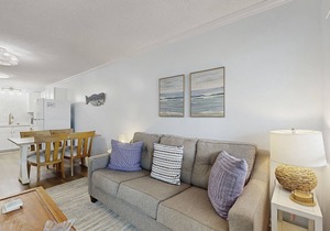 Casual condo steps from the beach with AC, balcony, resort pools, & free WiFi
