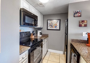 Cozy Beach Condo with Private Beach, heated pool, High Speed WiFi, and More.