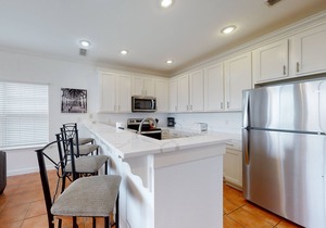 Newly renovated waterfront condo with pool, WiFi, W/D, & central AC