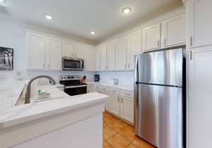 Newly renovated waterfront condo with pool, WiFi, W/D, & central AC