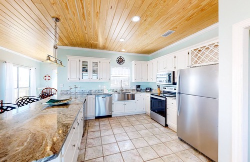 Dauphin Island House | Charming bay-front home with WiFi, spacious wraparound porch, private deck
