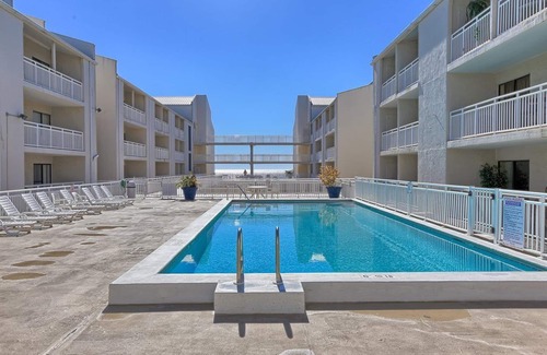 Orange Beach Condo | Cozy Beach Condo with Private Beach, heated pool, High Speed WiFi, and More.