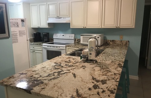 Orange Beach Condo | Sugar Beach 1st floor, Unit 132, 2BR/2BA, Side Gulf View, 3 Pools, 1 Kiddie Pool