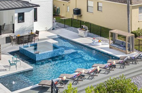 Golf and Sea Village of Apollo Beach House | 2 Million Villa Heated Pool w Luxury Spa 6BR & 6BR Waterfront by Canal