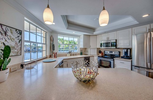 Caloosahatchee House | 2 Waterfront Villas, Dual Pools, Gulf Access & Tiki Hut Escape - Everlasting Paradise - Roelens