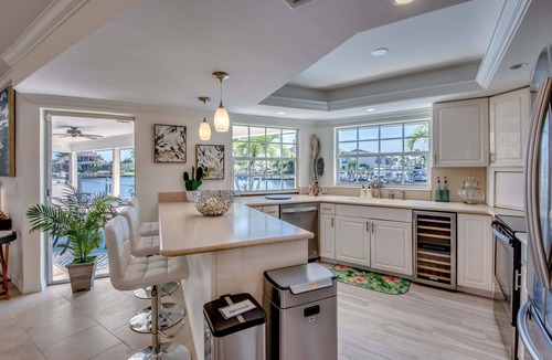 Caloosahatchee House | 2 Waterfront Villas, Dual Pools, Gulf Access & Tiki Hut Escape - Everlasting Paradise - Roelens
