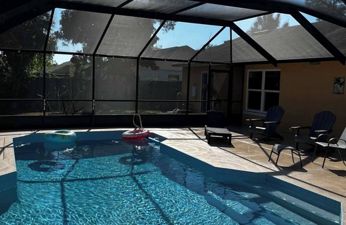 Cocoa House | 3-bedroom house in peaceful Cocoa with cool AC and pretty poolside views