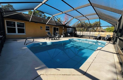 Cocoa House | 3-bedroom house in peaceful Cocoa with cool AC and pretty poolside views