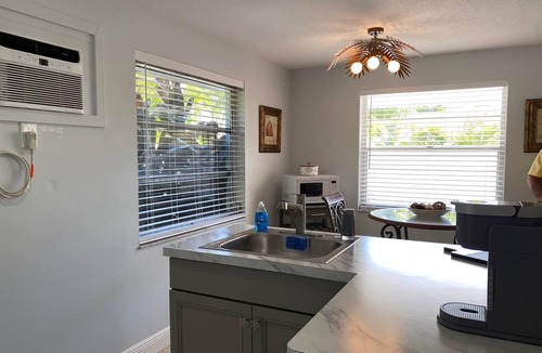 Holmes Beach Apartment | 3 Minute walk to beautiful AMI beach! Old Florida Charm with a Modern Flair!