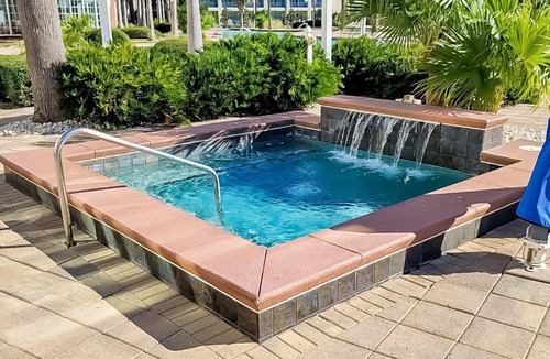 Upper Grand Lagoon House | 3rd-floor beach & pool-view condo with outdoor pool hot tub grills balcony