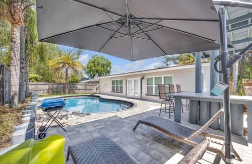 Isle of Palms Villa | 4BR Heated Pool, Putting Green & Outdoor Bar | Near Mayo Clinic Jacksonville | Sleeps 10 SMV