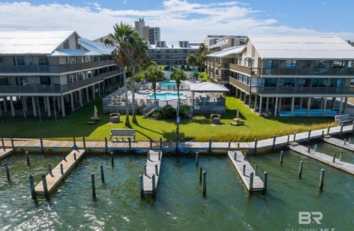 Orange Beach East Condo | A short stroll to the white sand beach of the Gulf of Mexico and Ole River.