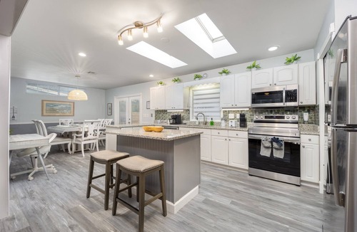 North River Shores House | Arcade · Firepit · 2 King Beds + Workspace