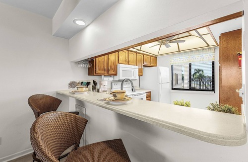 Mid Island Condo | Bayview Bliss Near the Beach with Resort Amenities & Sunroom - Serenity by the Shore