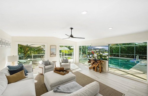 Stuart House | Beautiful 4BR, 3.5BA Stuart retreat with a private screened-in pool. Sleeps 9 and features two en-suite rooms, a modern kitchen, open living, and peaceful canal views perfect for bringing your fishing poles. Minutes to Downtown, dining, and beaches.