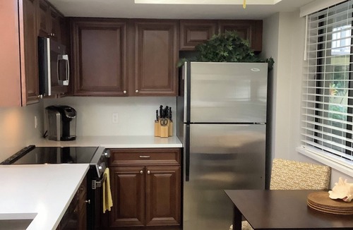 Bonita Bay Condo | Beautifully Renovated Lakeview Corner Condo. Private Beach, Pool and Spa