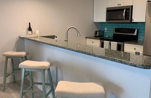 Moorings Condo | Beautifully renovated 2/2 condo on marina and short walk to private beach!