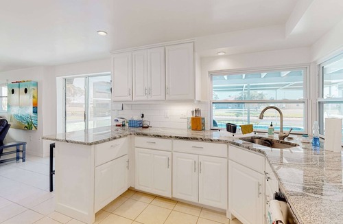 Oakland Hills House | Bright Florida home with pool, gas grill, private pool, and washer/dryer