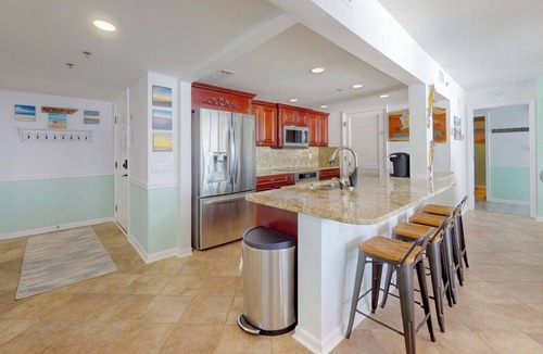Long Beach Condo | Bunta's Beach Haven - 20' covered balcony, all waterfront bedrooms, in-law suite