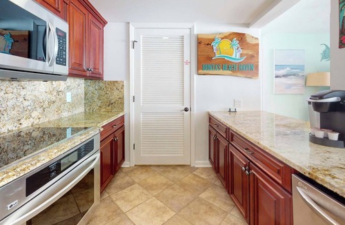 Long Beach Condo | Bunta's Beach Haven - 20' covered balcony, all waterfront bedrooms, in-law suite