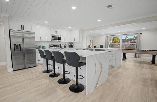 Port Richey House | Canal Front Getaway | Pool, Dock, Game Room + Screened Porch