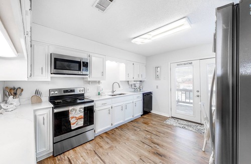 Royal Lagoons House | Canalside home with room for a boat - short walk from the beach