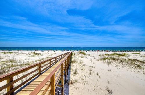 Fort Morgan House | Casual condo steps from the beach with AC balcony resort pools & free WiFi