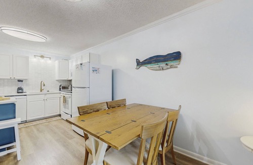 Fort Morgan Condo | Casual condo steps from the beach with AC, balcony, resort pools, & free WiFi