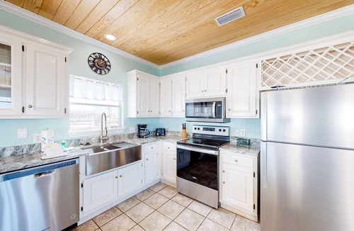 Dauphin Island House | Charming bay-front home with WiFi, spacious wraparound porch, private deck