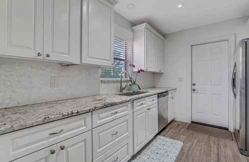 Parrot Cove House | Charming Lake Worth Beach Pool Home –Heated Pool, Walk to DT, 1 M to Beach!